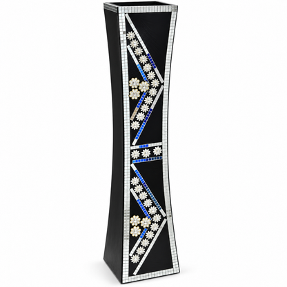A tall, narrow black decorative vase with a tapered shape, featuring intricate mosaic inlay designs in white, blue, and silver on a plain white background.