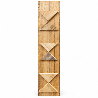 A vertical art piece featuring three stacked geometric panels with triangular cutouts and inlaid accents, shown against a plain white background.