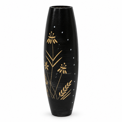 A tall, black ceramic vase with a glossy finish, decorated with hand-painted gold botanical motifs and small white dots, set against a plain white background.