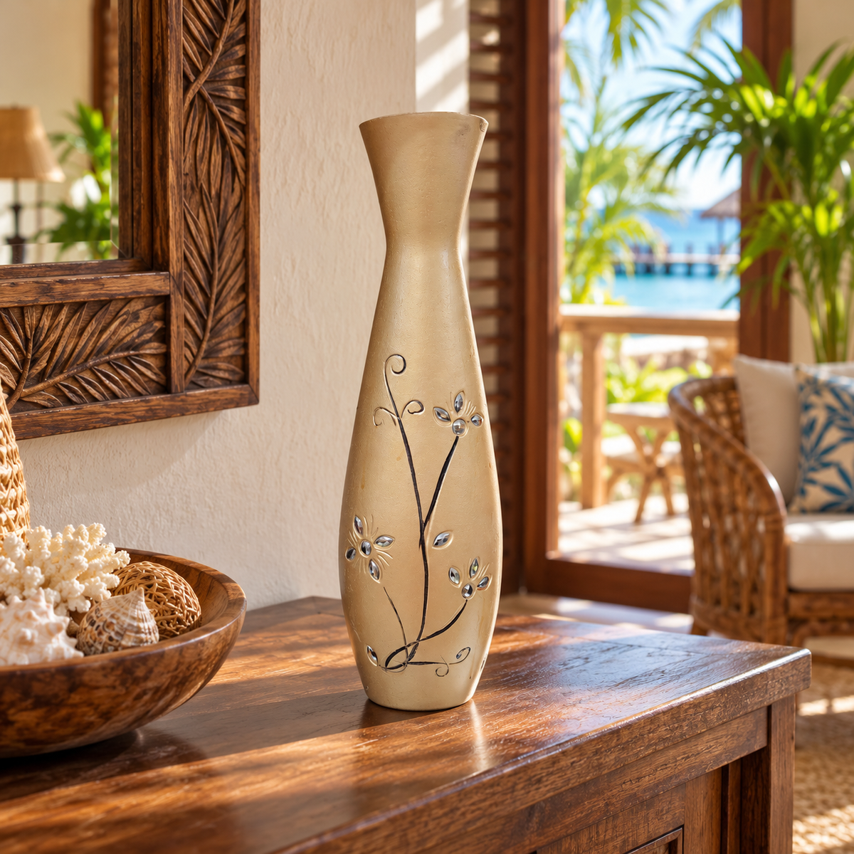 A tall, slender ceramic vase with a beige finish and delicate black floral vine patterns, displayed on a wooden console table in a tropical resort setting.